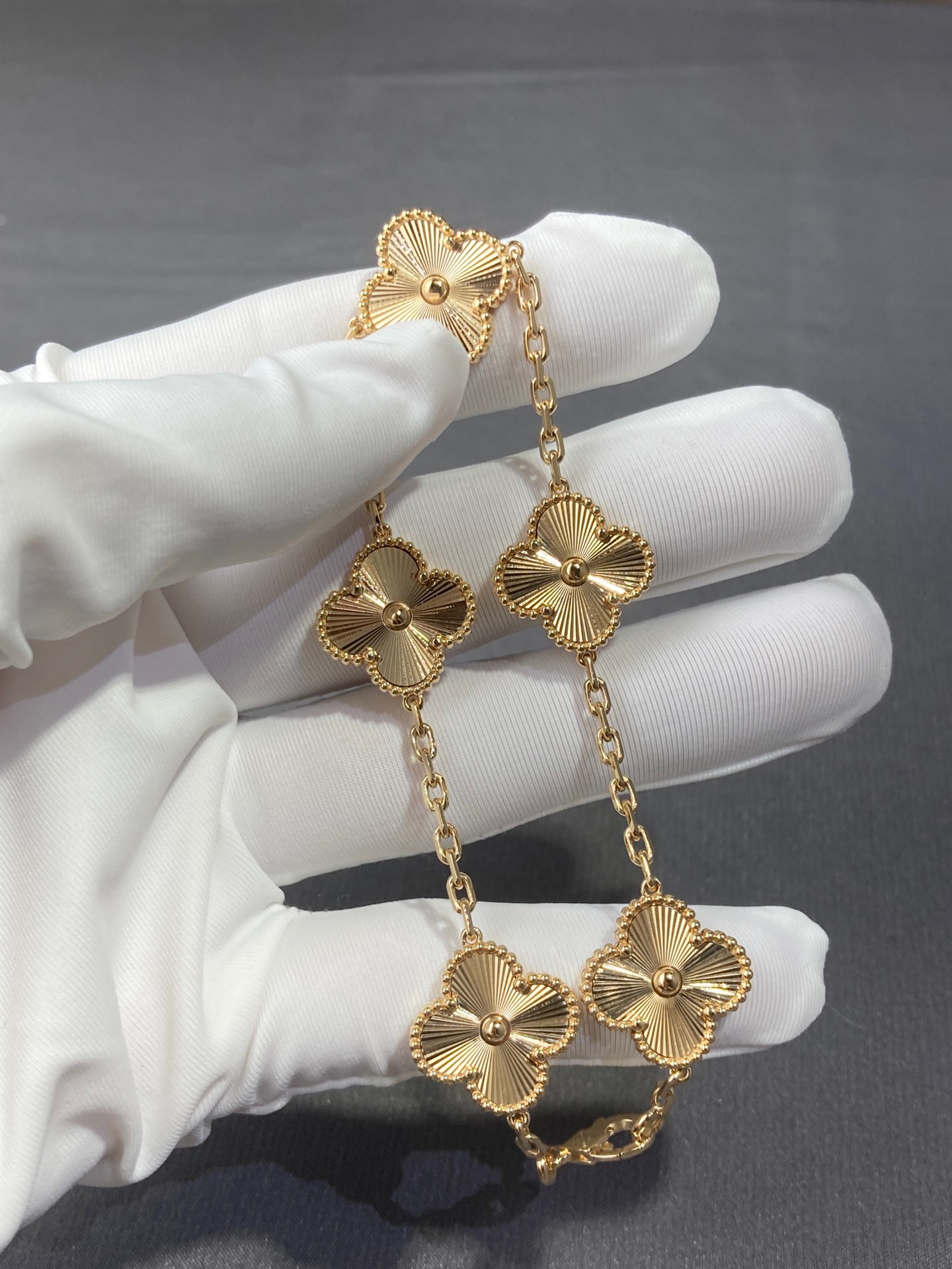 Vintage Alhambra bracelet 5 motifs guilloché yellow 18k gold.