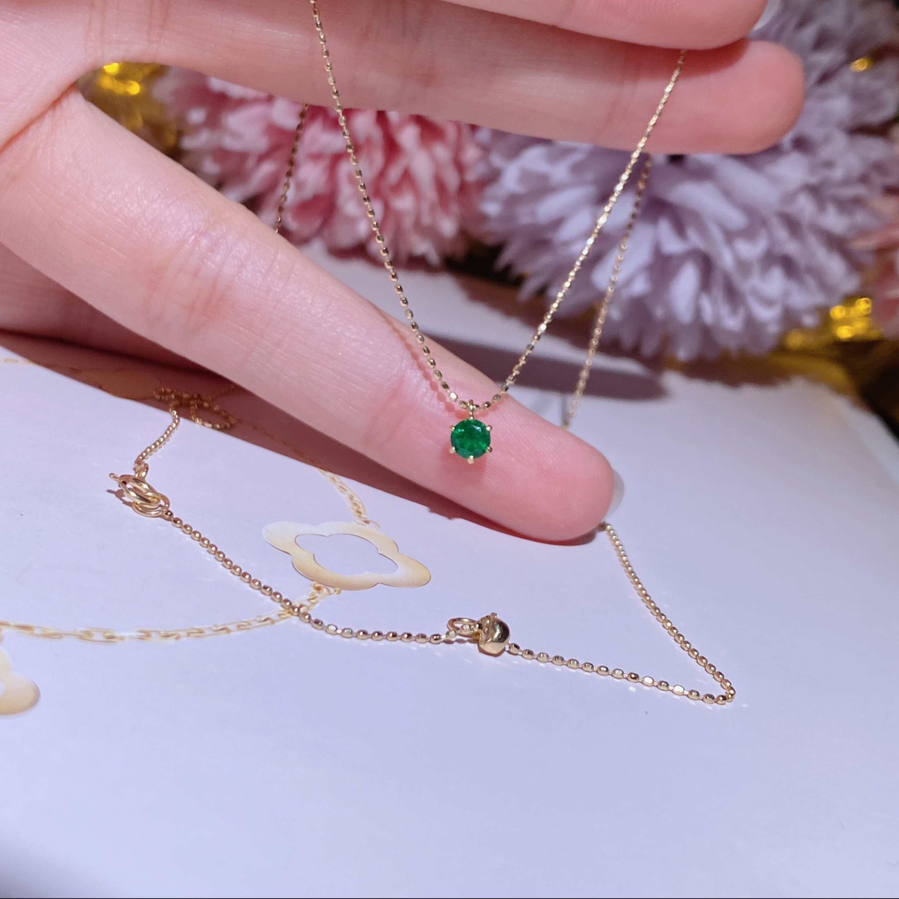 Hong Kong Shop Small Emerald Necklace Set in 18k gold with emerald stones.