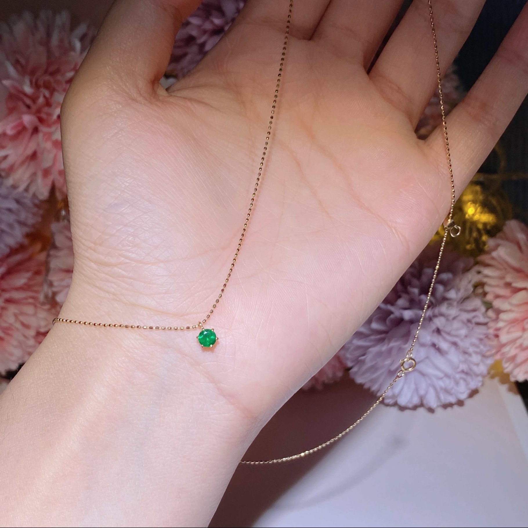 Hong Kong Shop Small Emerald Necklace Set in 18k gold with emerald stones.