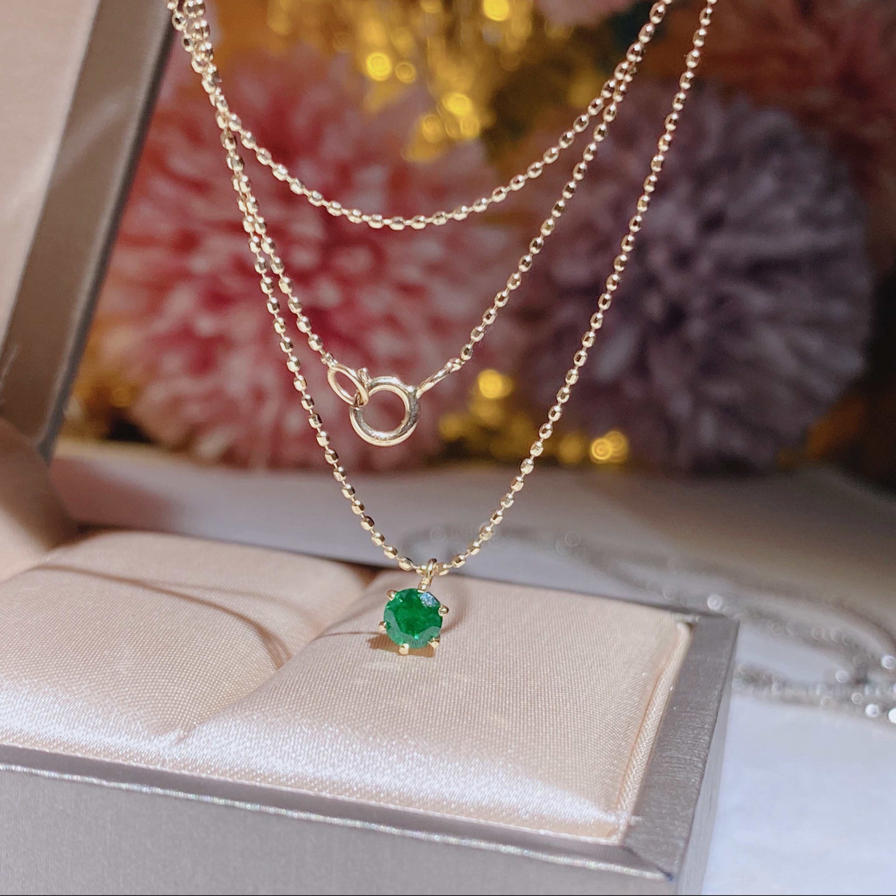 Hong Kong Shop Small Emerald Necklace Set in 18k gold with emerald stones.