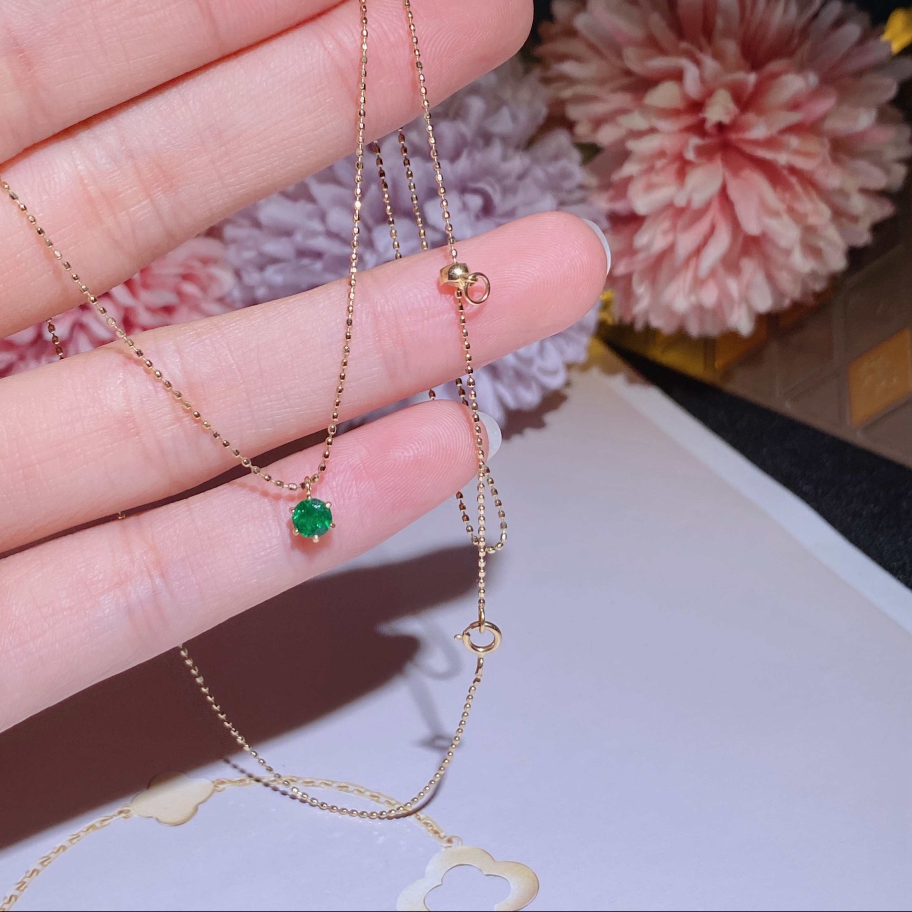 Hong Kong Shop Small Emerald Necklace Set in 18k gold with emerald stones.