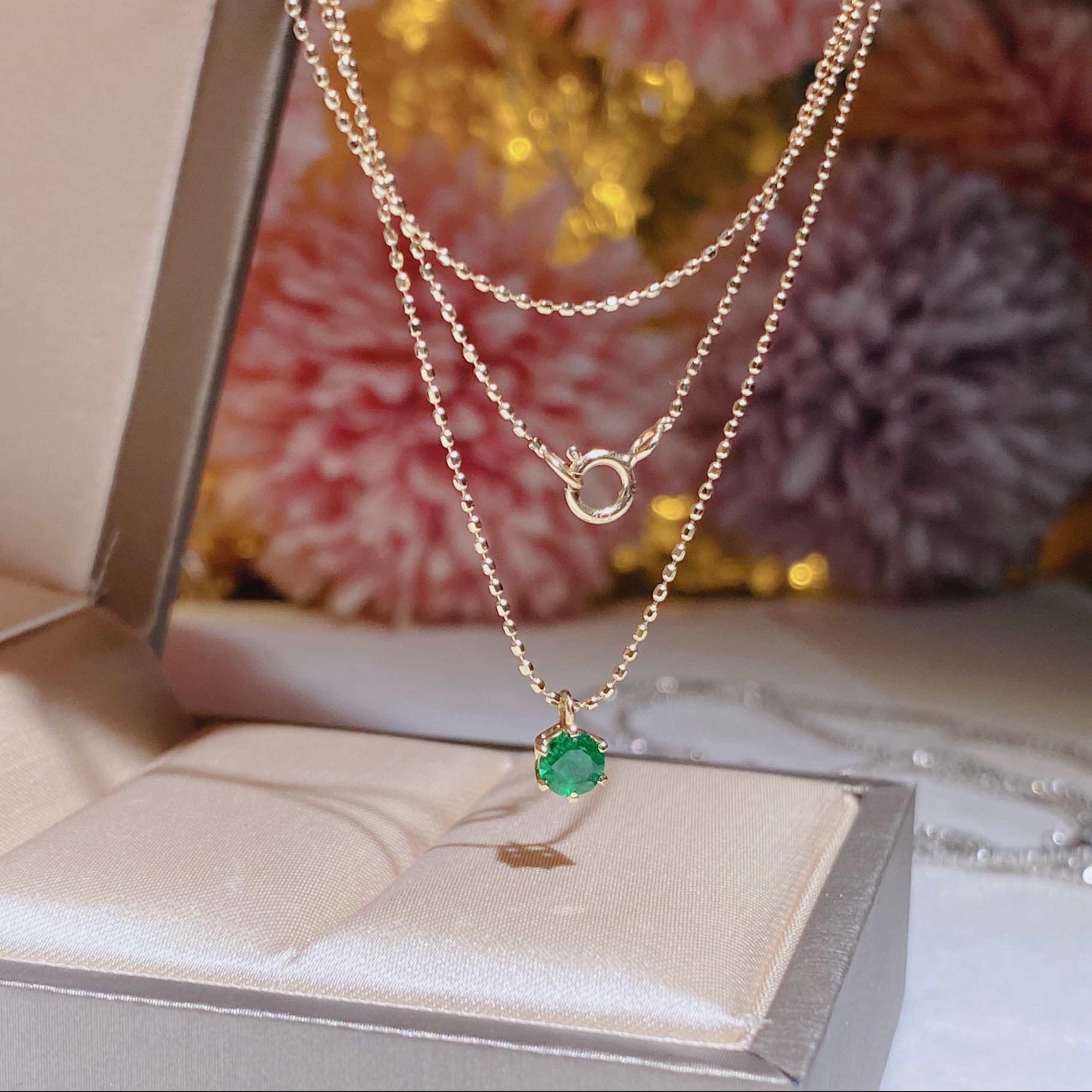 Hong Kong Shop Small Emerald Necklace Set in 18k gold with emerald stones.